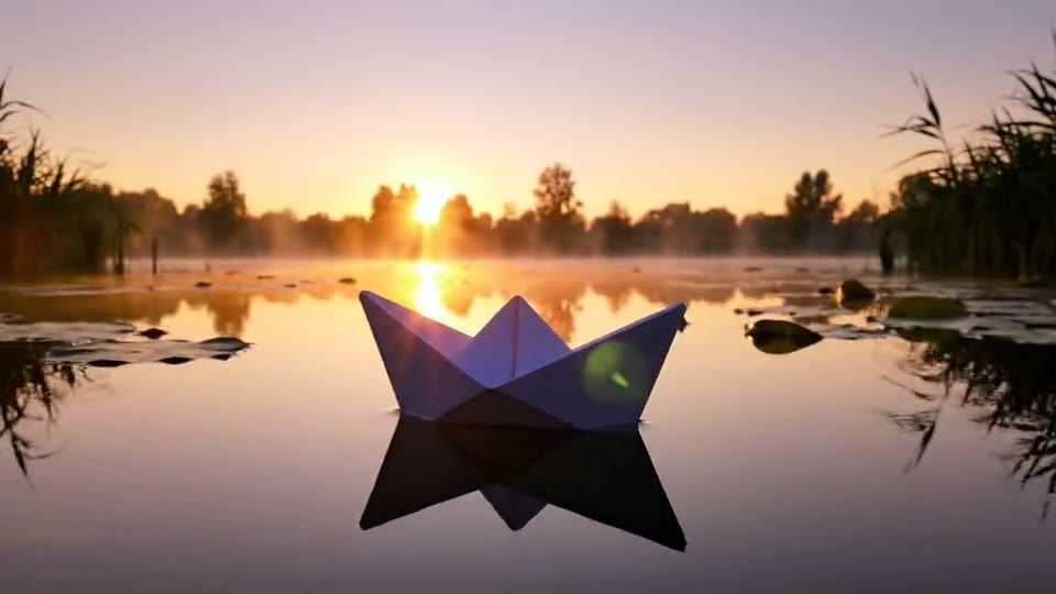 Veo 3.1 Fast output: A paper boat drifting across a quiet pond at sunrise, slow pan left.